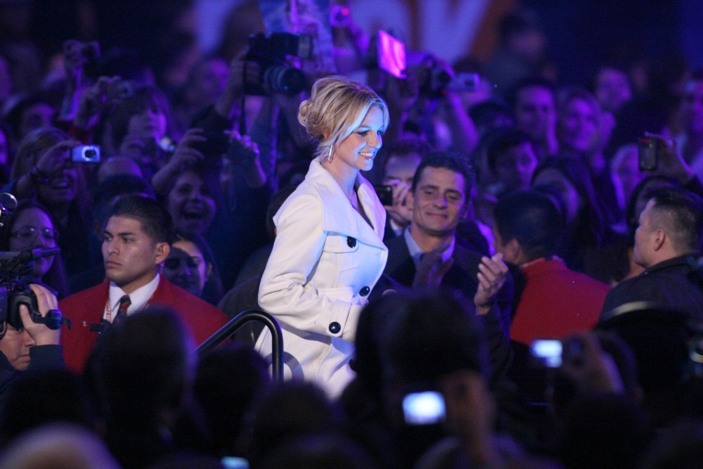 photograph of Britney Spears walking through crowd at event