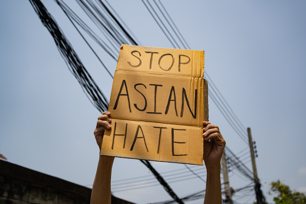 photograph of "Stop Asian Hate' sign being held