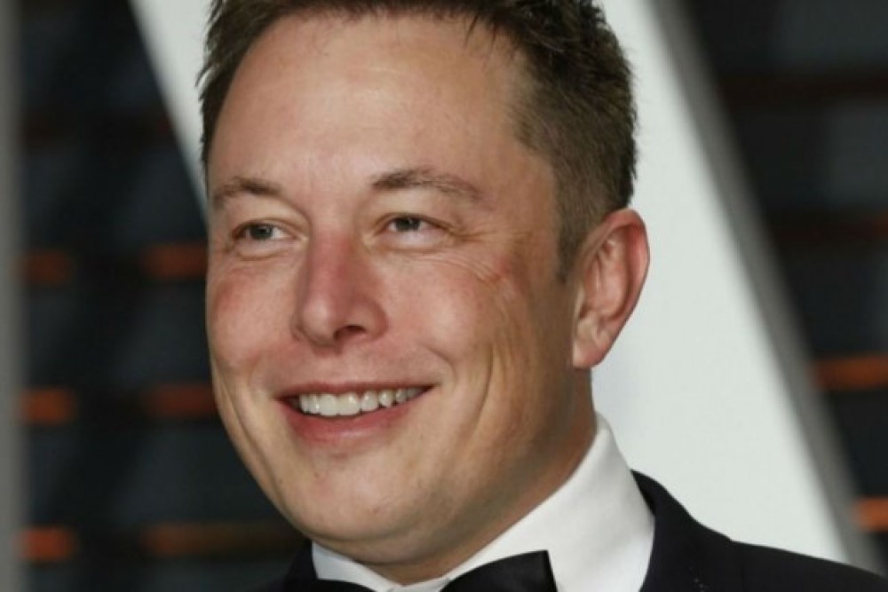 headshot photograph of elon musk in a tux