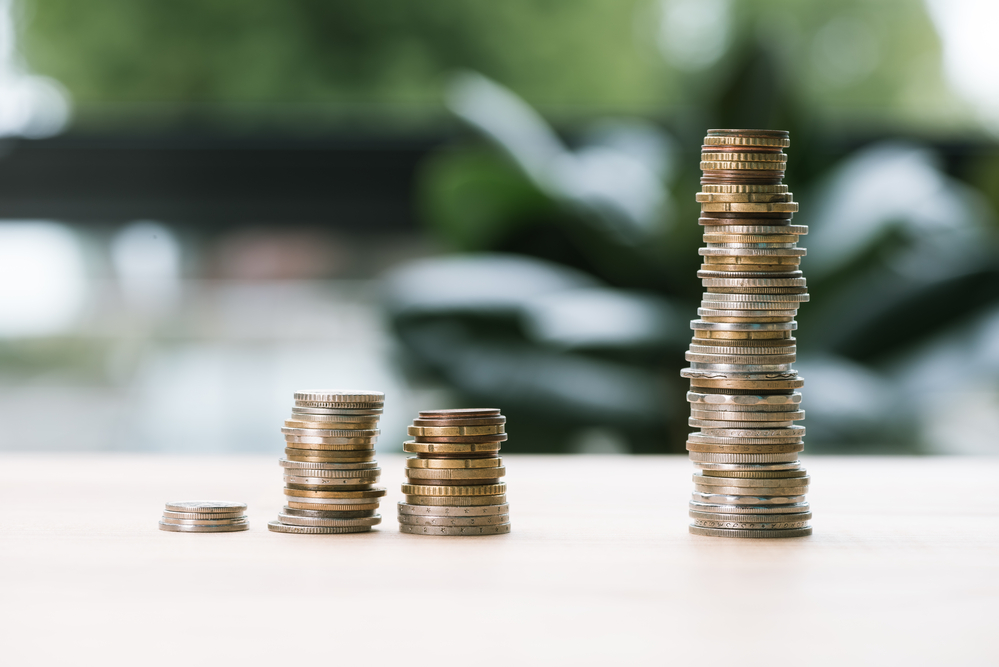 photograph of unequal columns of stacked coins