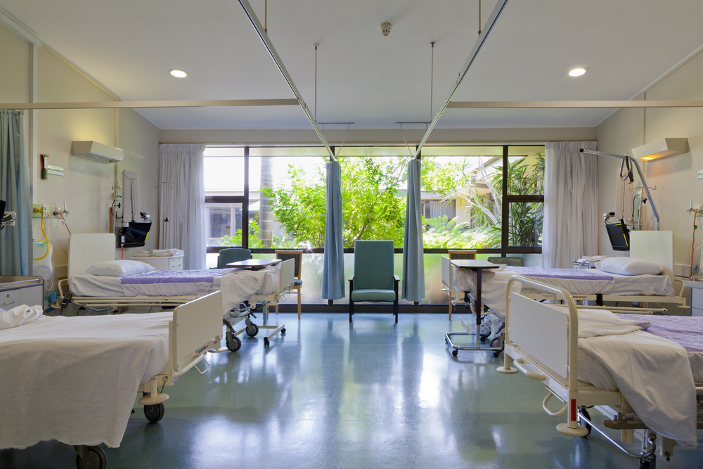 photograph of hospital room with empty beds