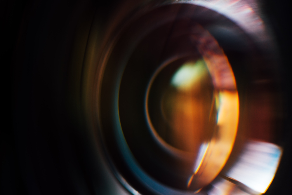 image of camera lens blended with an image of an eye
