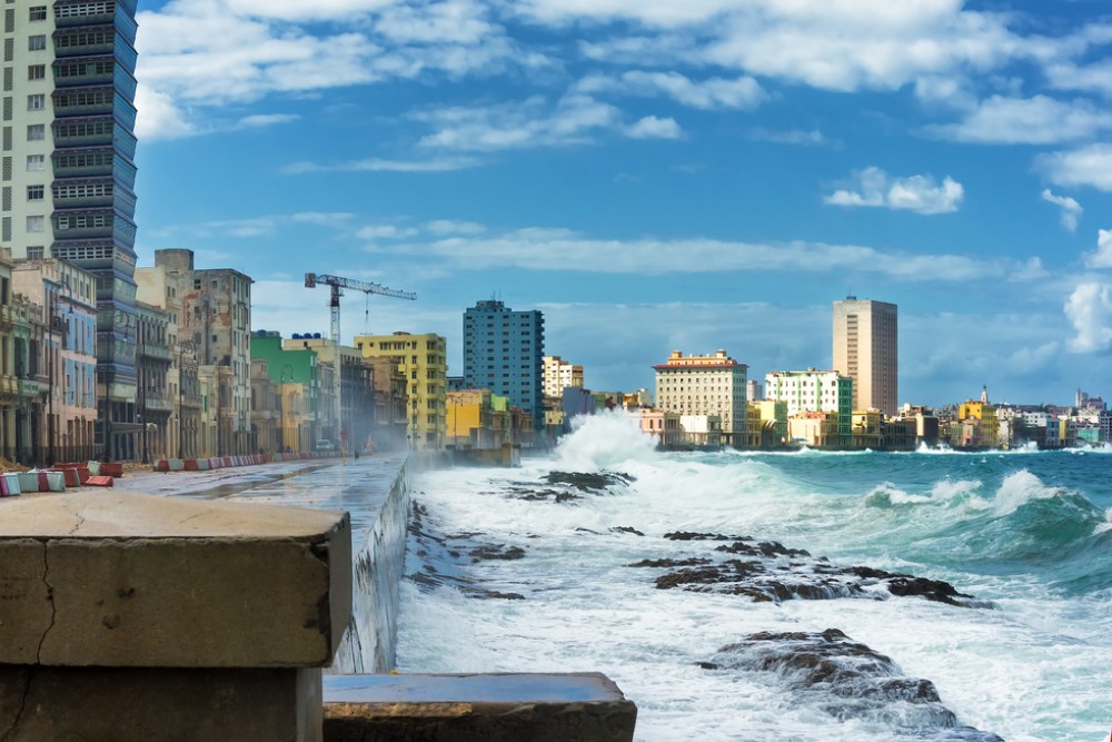 photograph of waves threatening coastal city