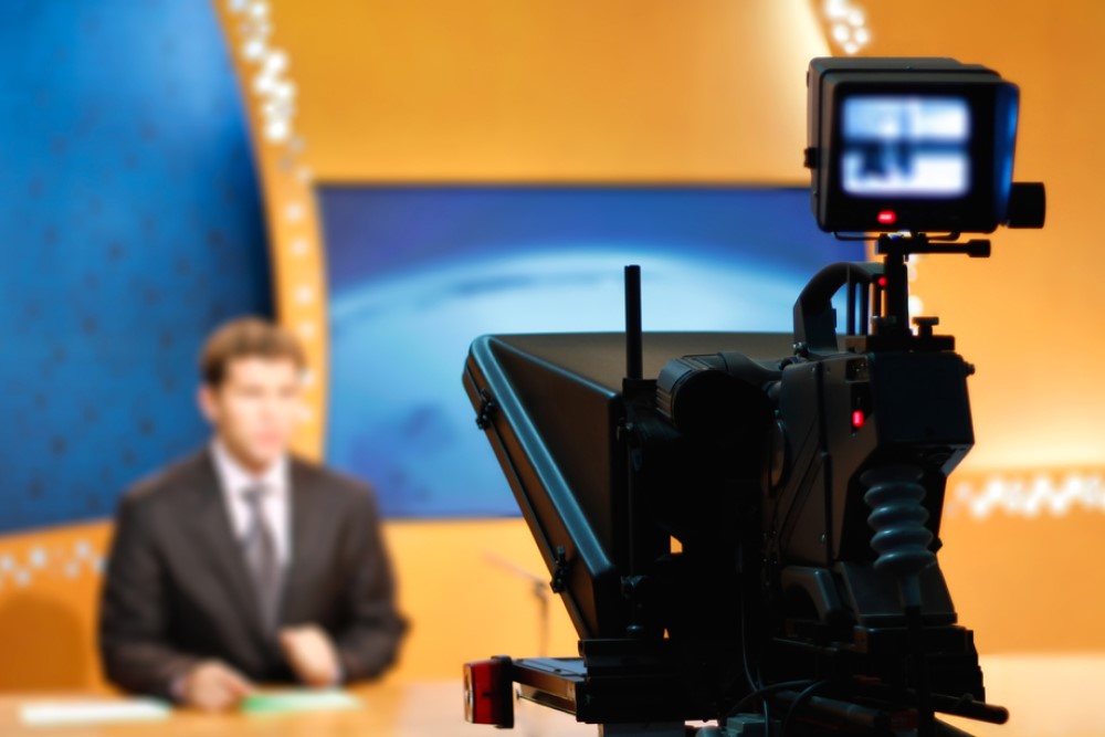 photograph of TV camera in news studio