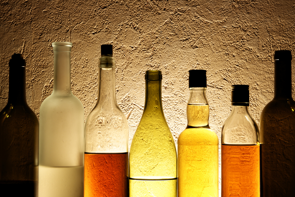 photograph of alcohol bottles on shelf