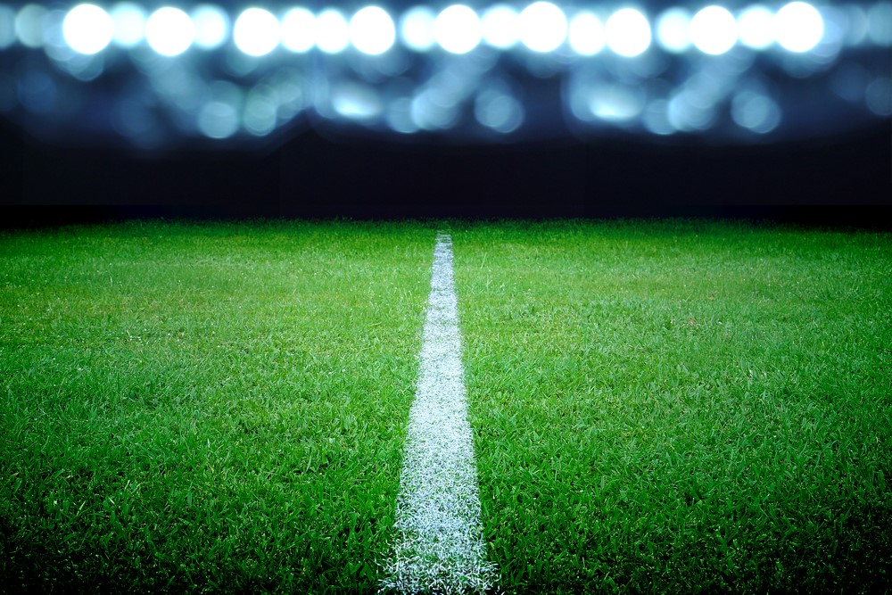 image of lined field under bright lights