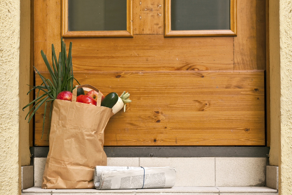 photograph of grocery bag delivered on doorstep
