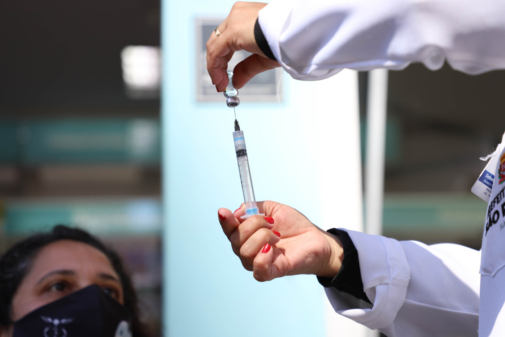 photograph of COVID vaccination in outdoor tent