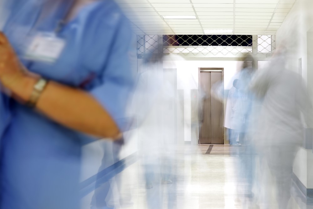 blurred photograph of busy hospital hallway