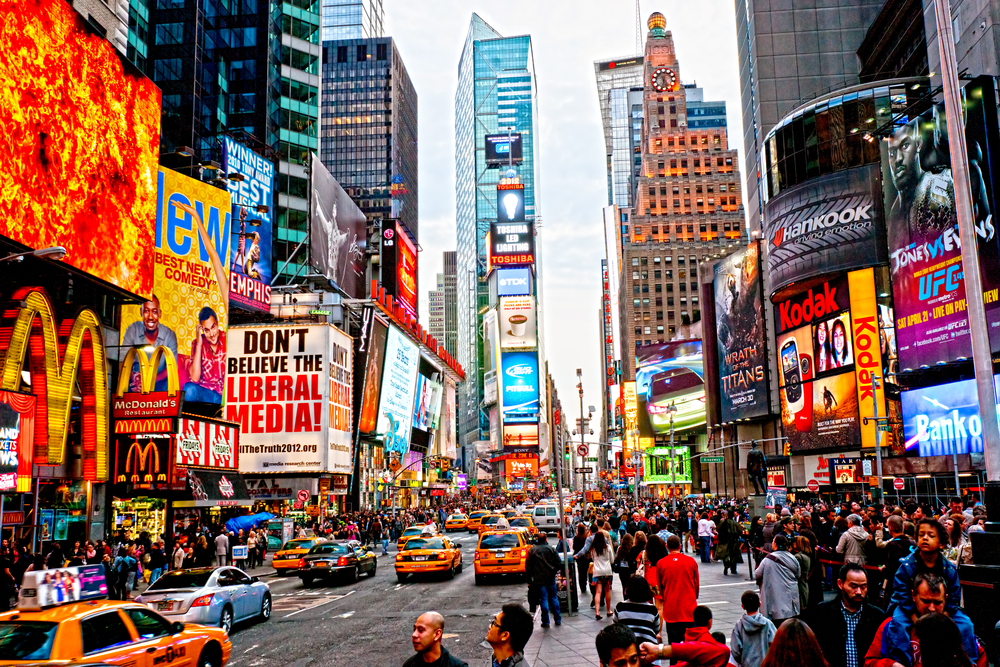 photograph of billboards and crowds at Times Square