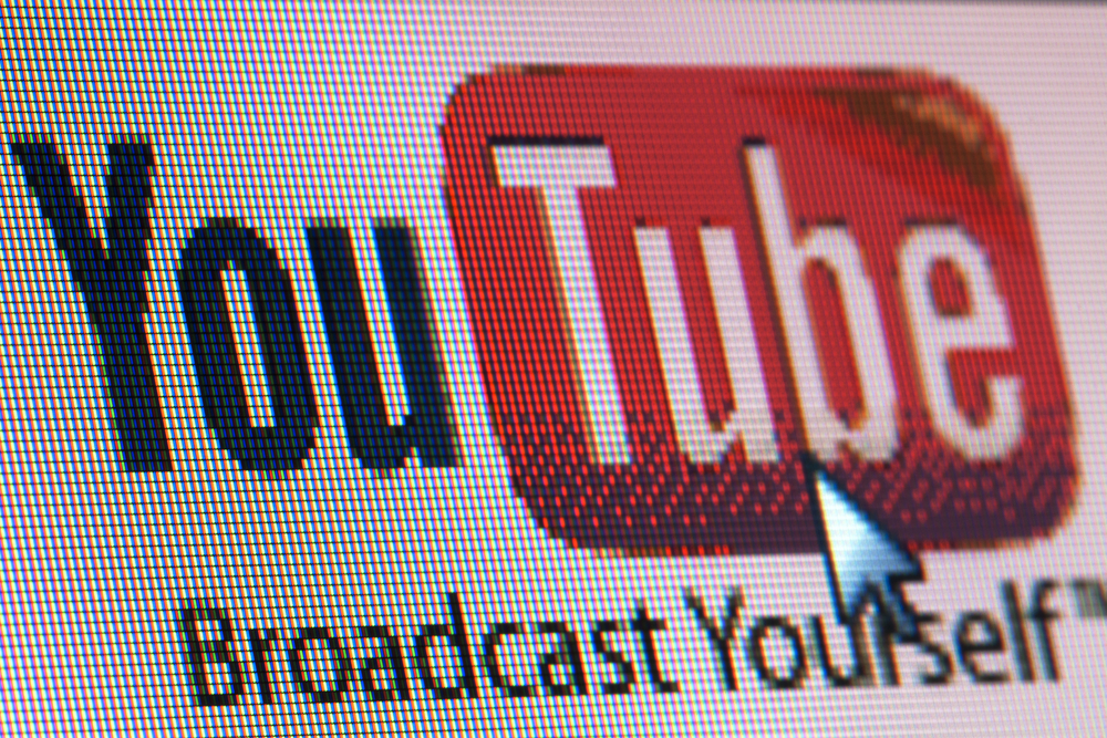photograph of computer screen displaying YouTube icon