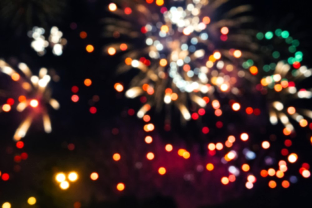 blurred photograph of fireworks in night sky