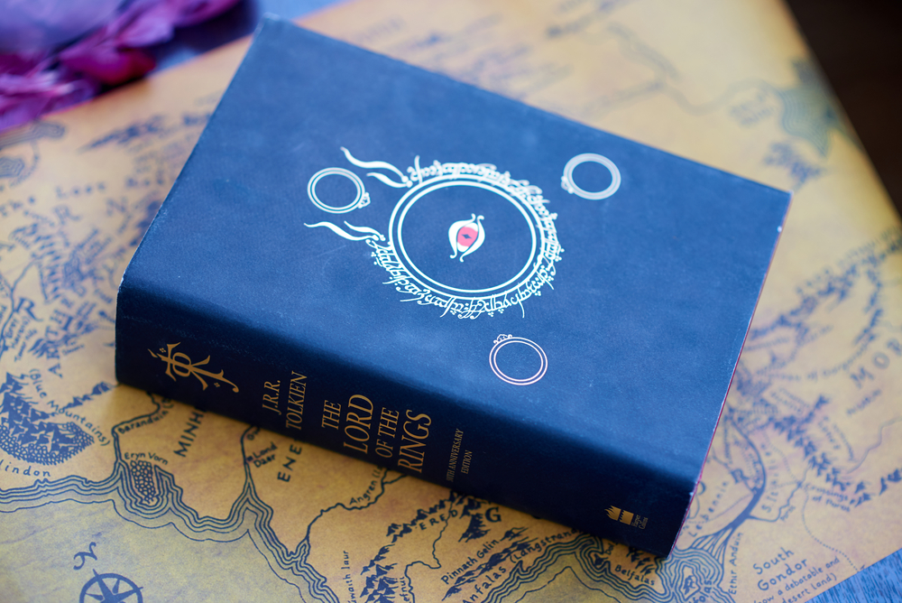 photograph of Lord of the Rings book atop Middle-Earth map