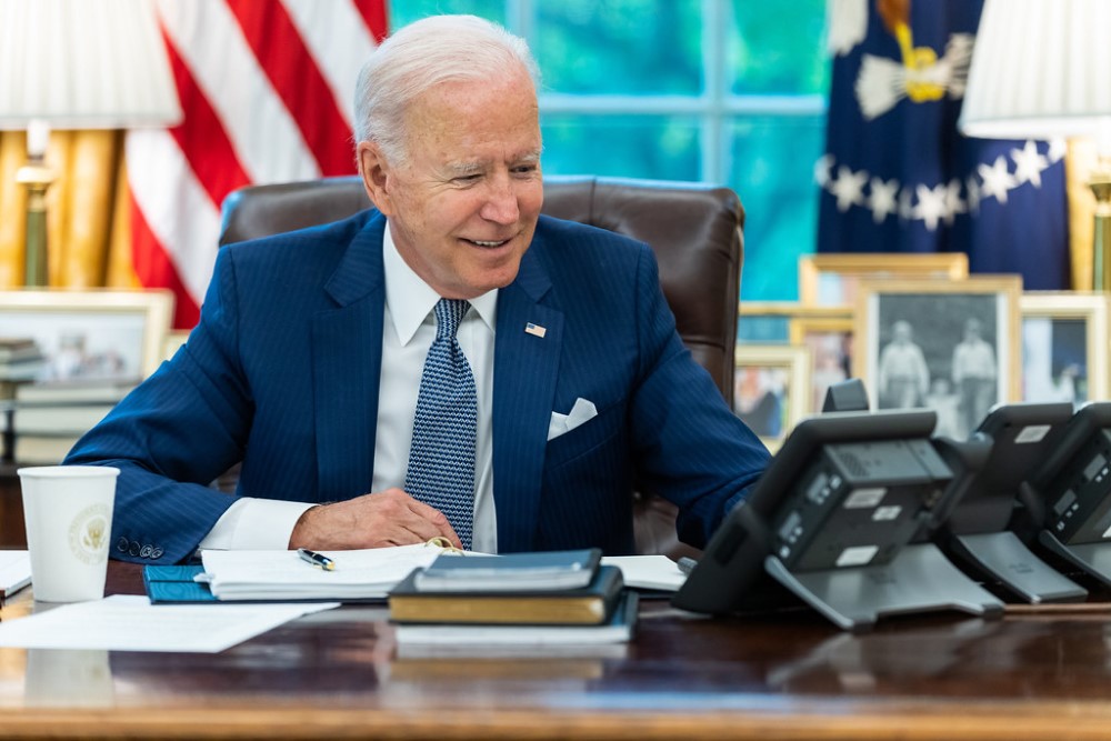 photograph of Biden on phone in Oval Office