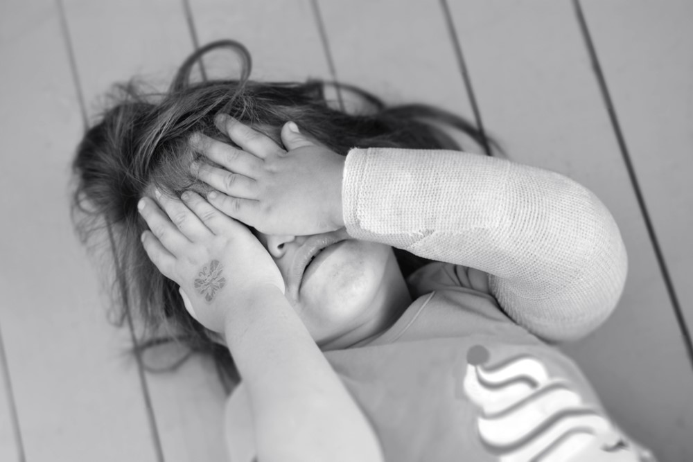 black-and-white photograph of embarrassed child