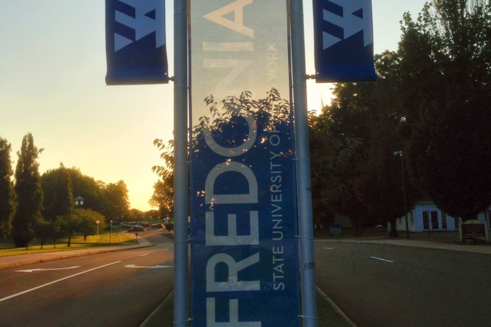 photograph of SUNY Fredonia sign at dusk