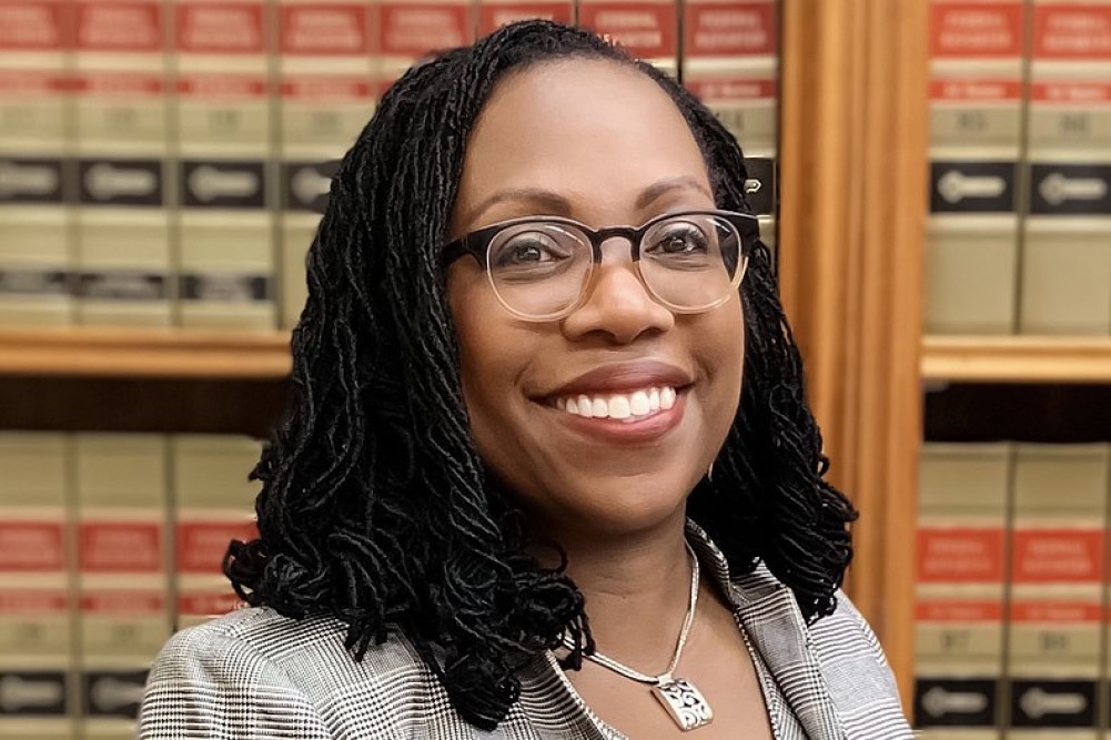 photograph of Ketanji Brown Jackson with law books behind