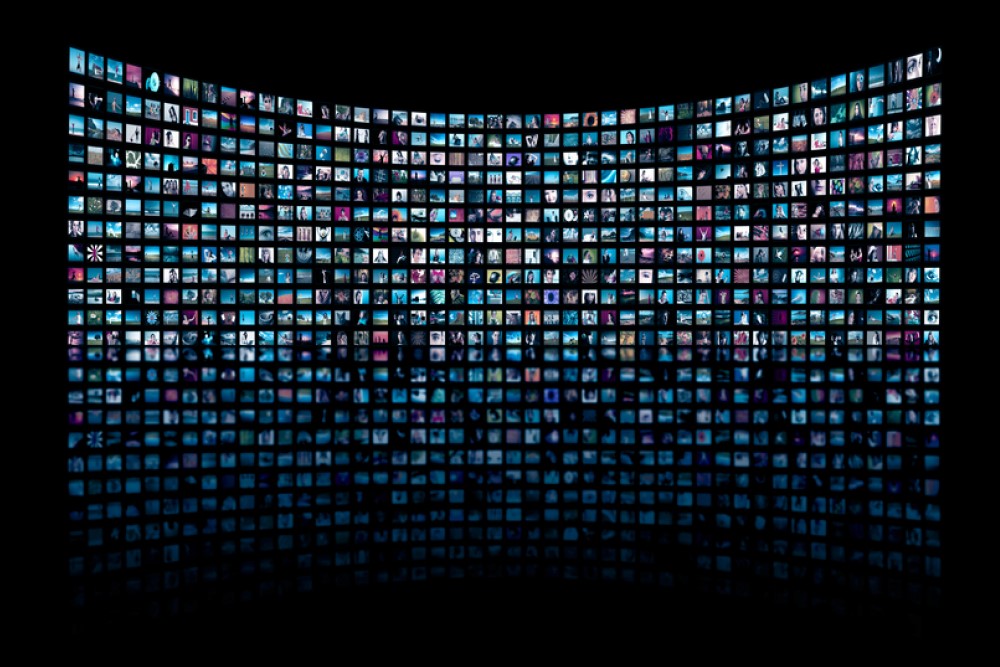 image of wall of tvs each displaying something different