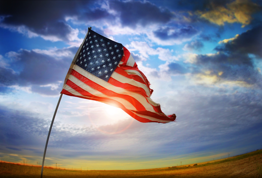 Wide-angle photo of a tattered American flag