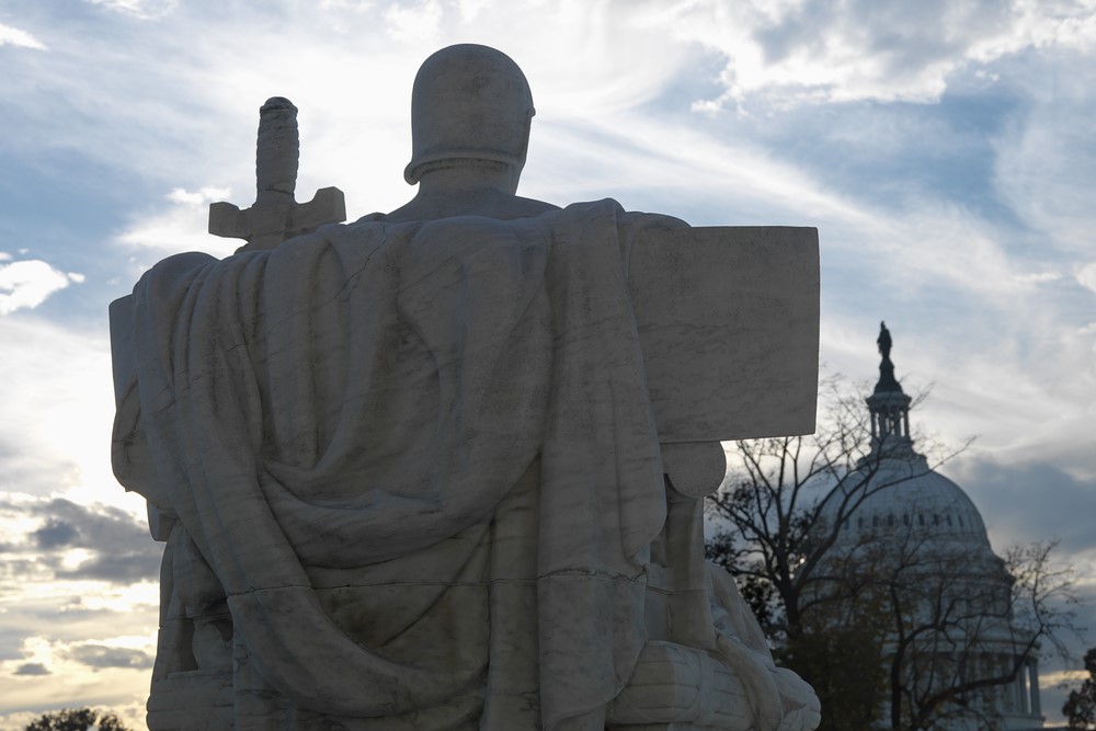 photograph of Authority of Law statue facing out from Supreme Court building