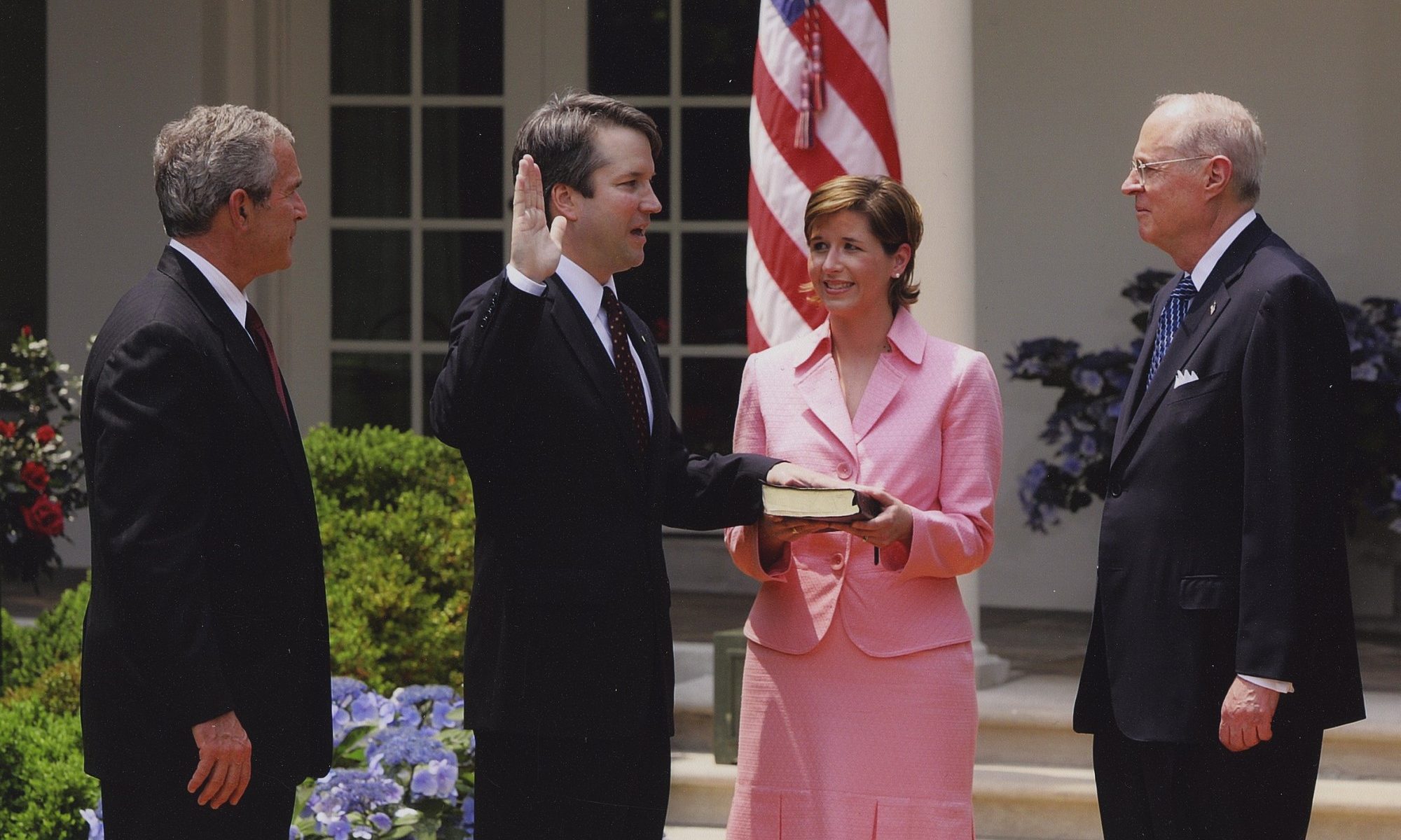 photograph of Kavanaugh being sworn in with hand on Bible