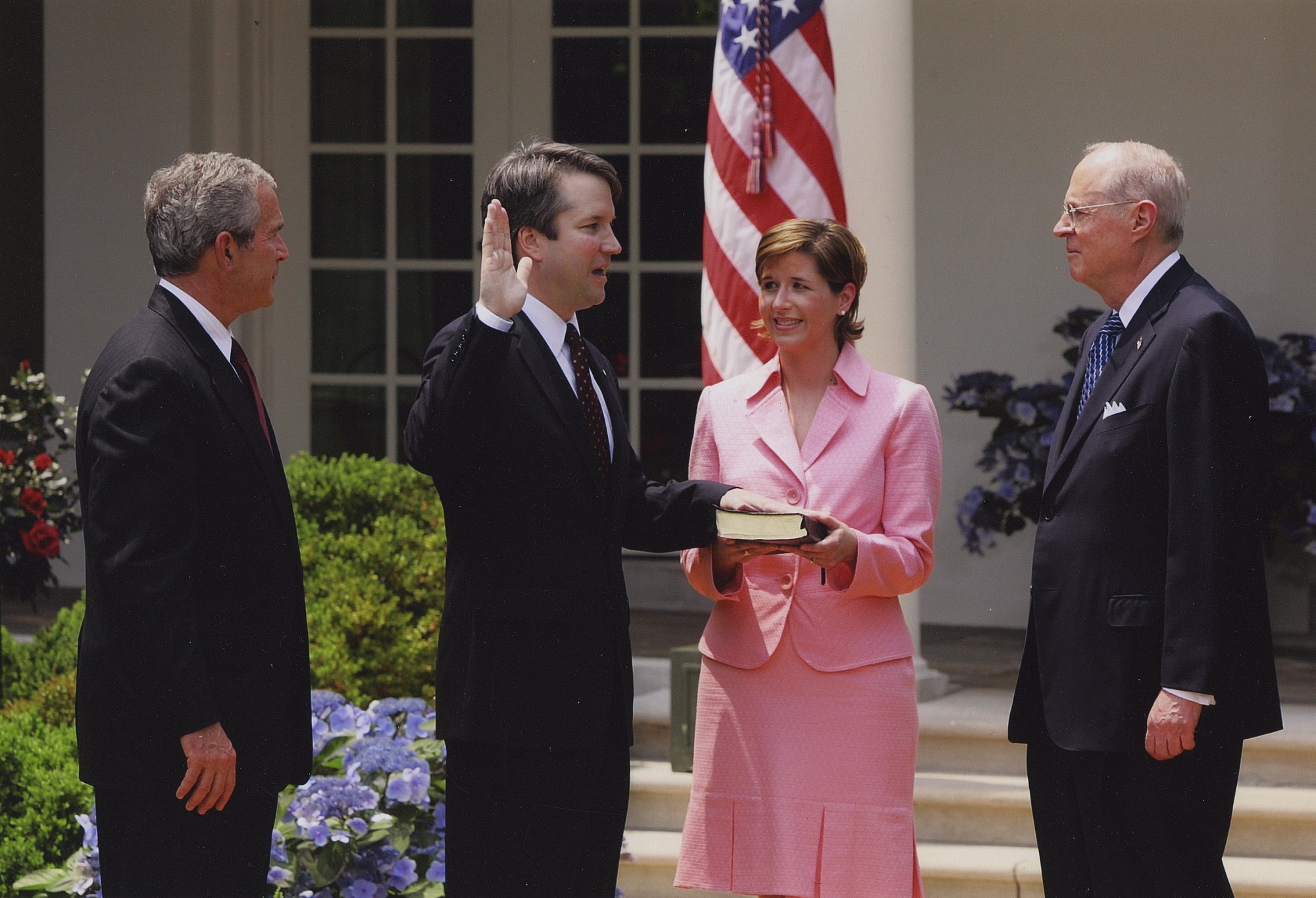 photograph of Kavanaugh being sworn in with hand on Bible