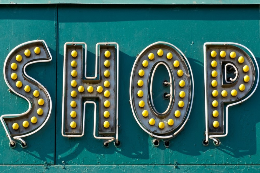 close-up photograph of SHOP storefront sign