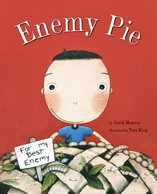 Cover illustration for Derek Munson's book "Enemy Pie" featuring a small white boy with a wide smile hovering over a giant pie filled with worms and gross green things. There's a sign in the pie that says "For my best enemy"