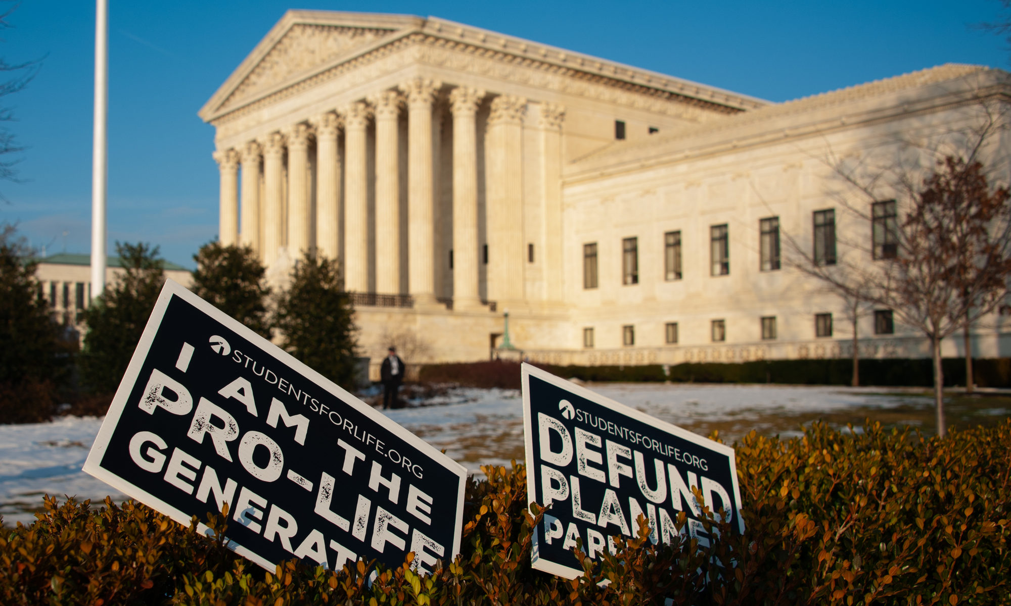 photograph of abandoned pro-life signs in front of Supreme Court Building