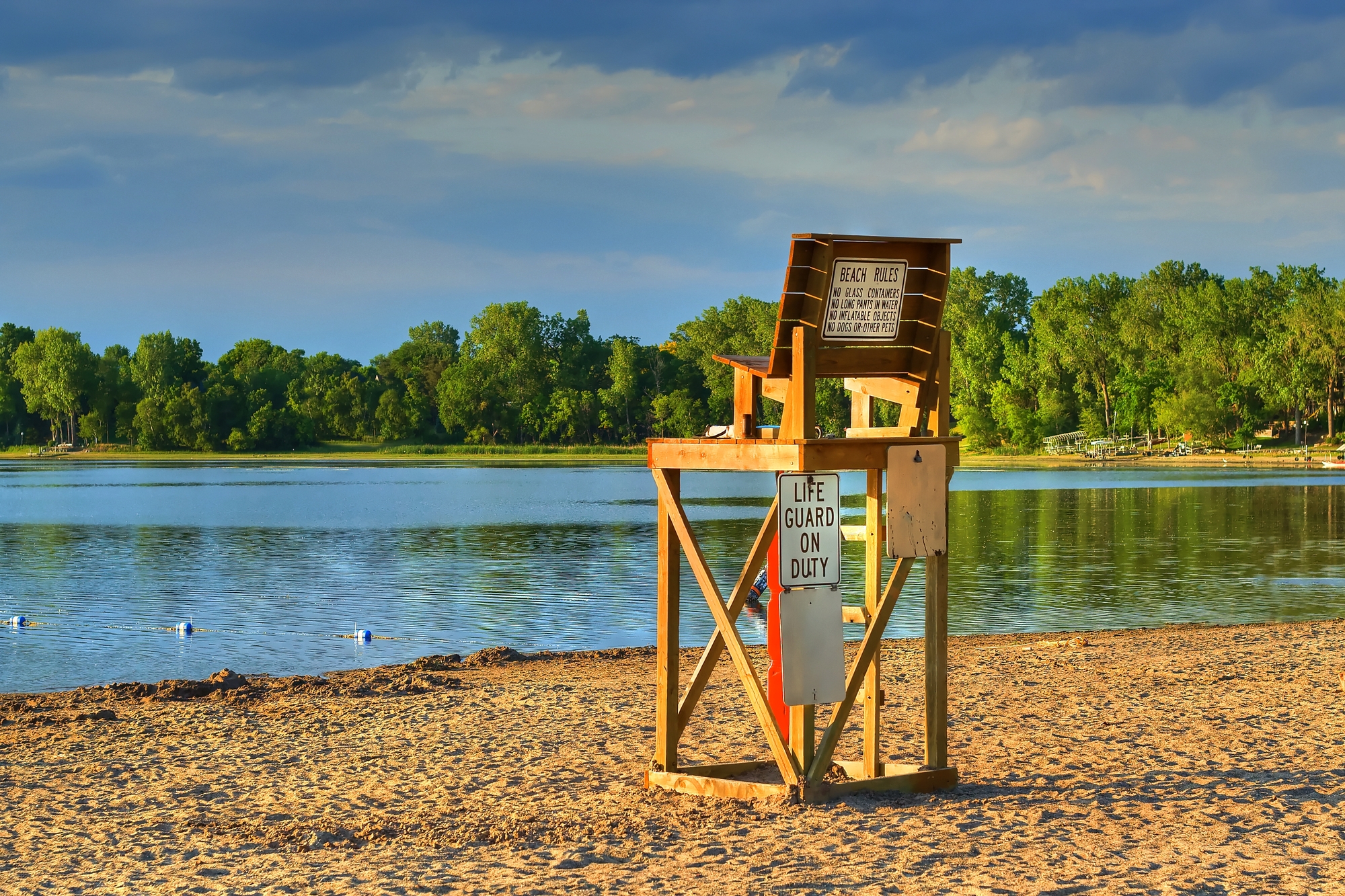 photograph of empty chair with "Lifeguard On Duty" sign displayed