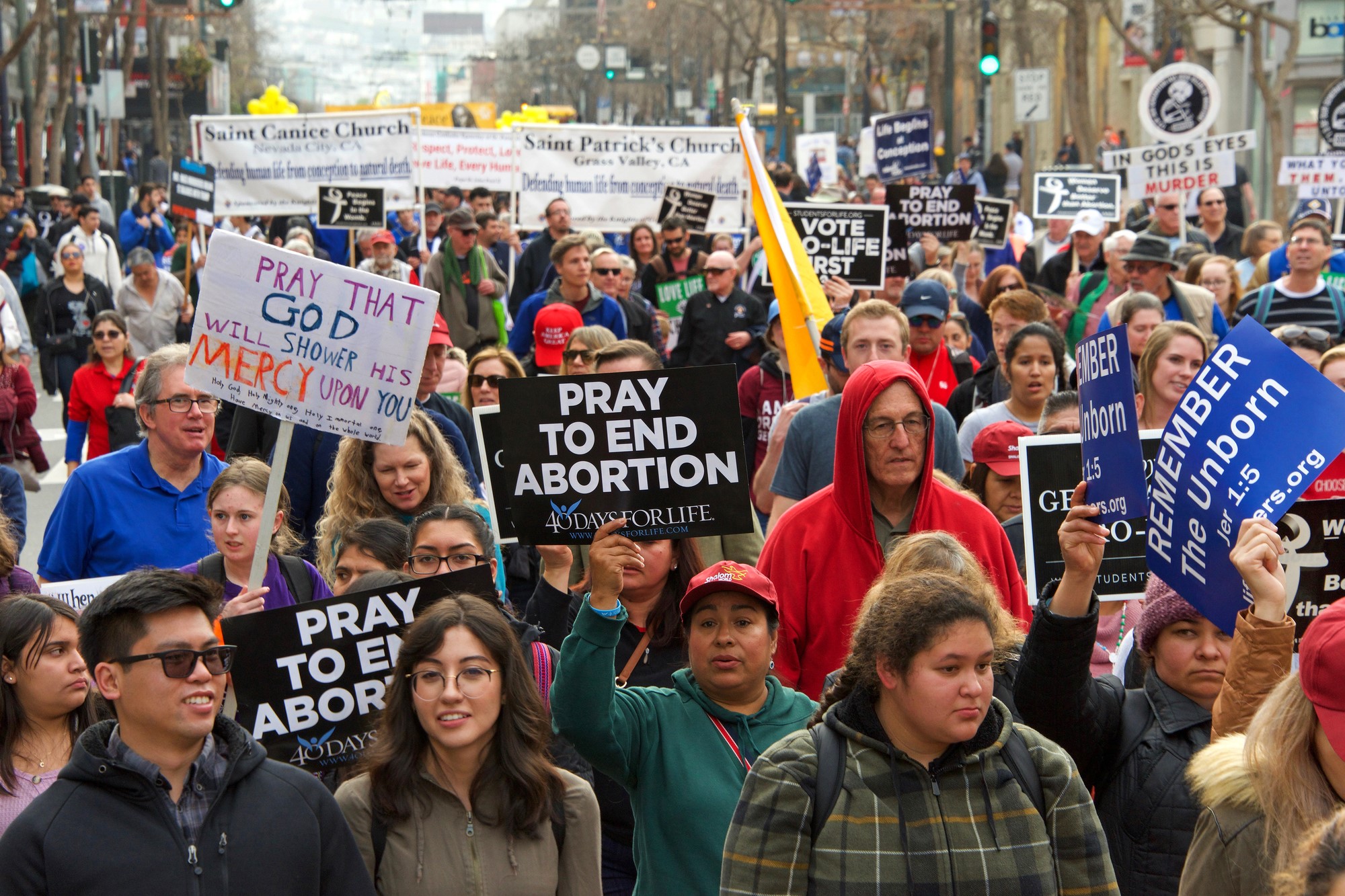 photograph of pro-life protesters with religious abortion signs