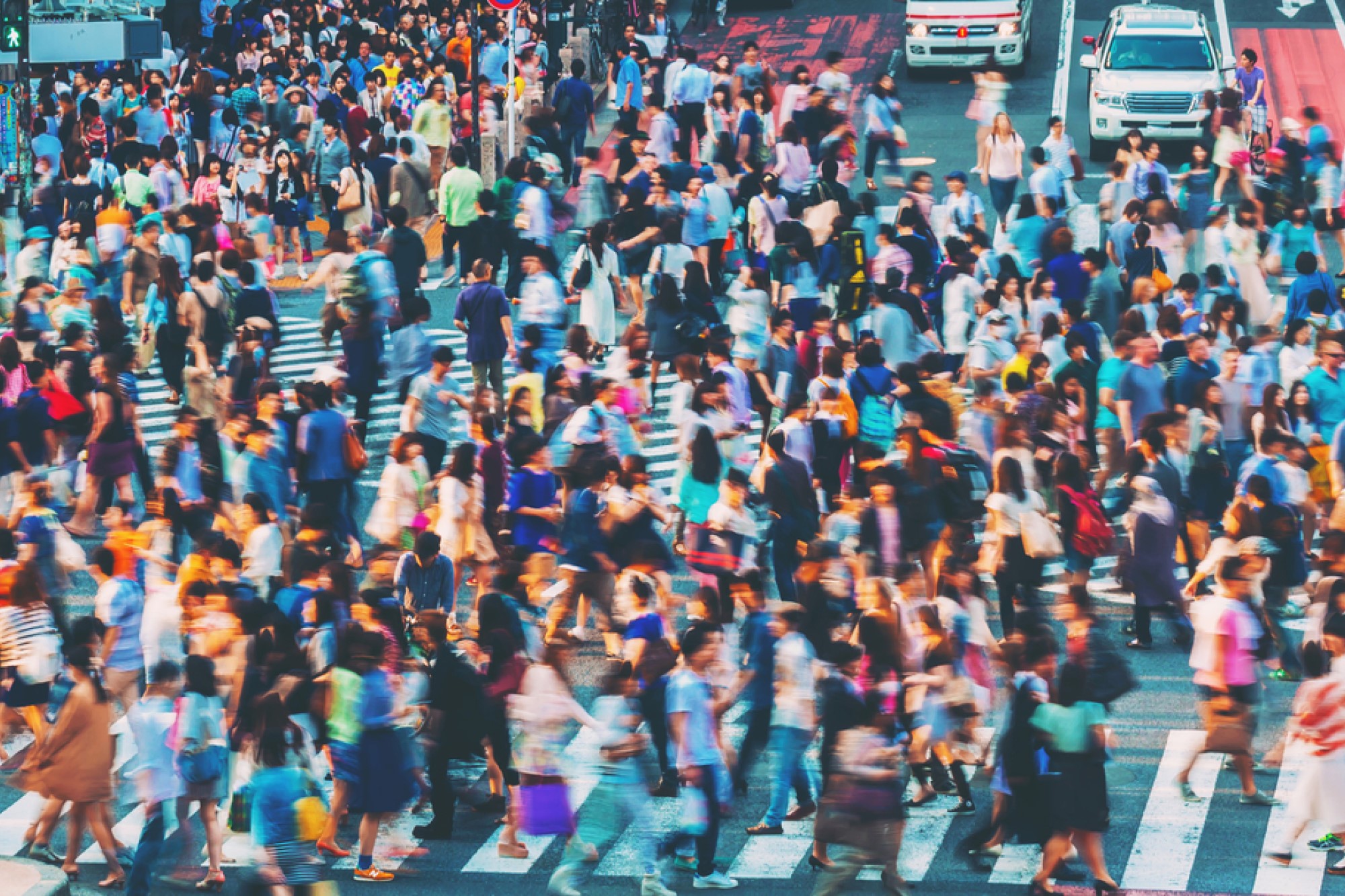 photograph of crowded pedestrian intersection