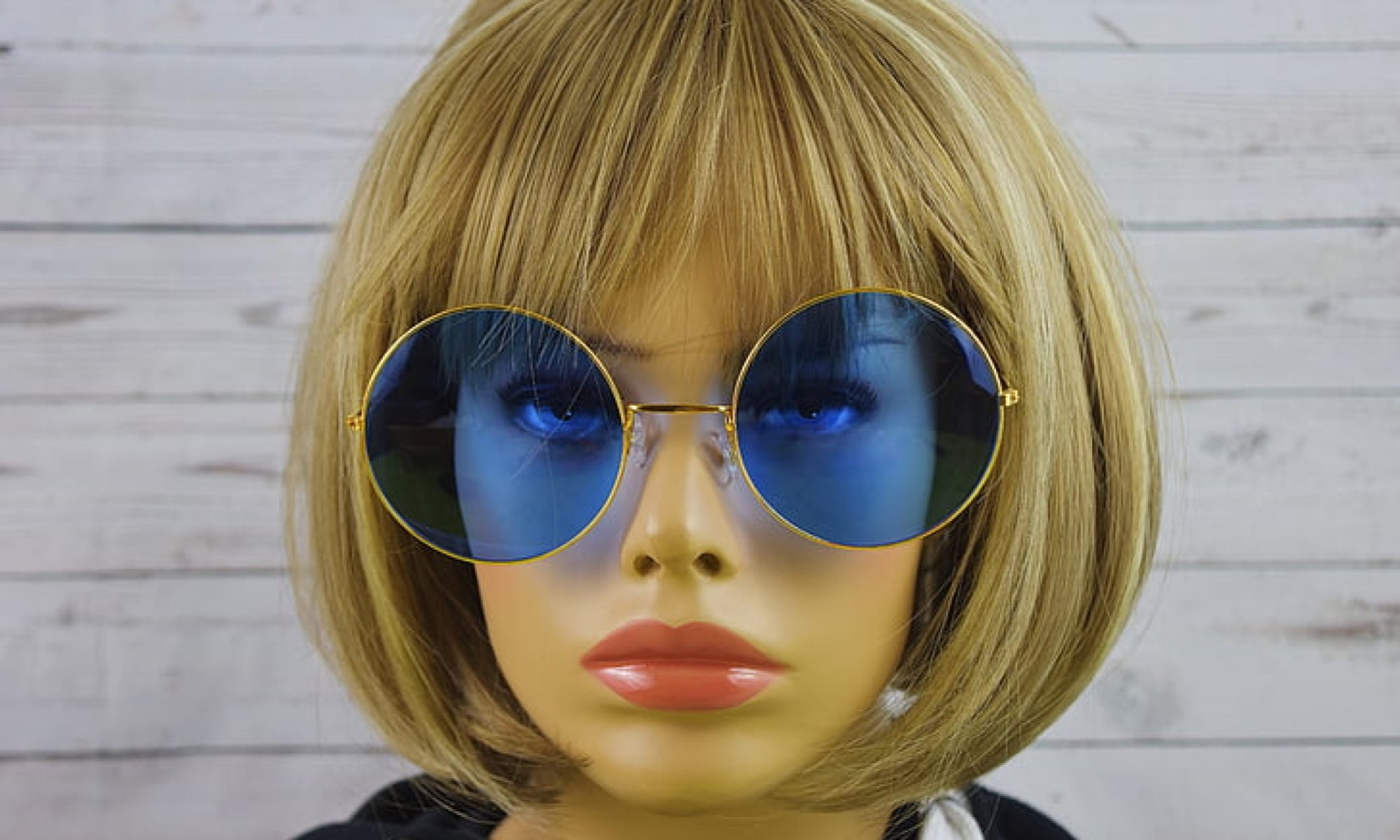 photograph of mannequin in sunglasses and wig