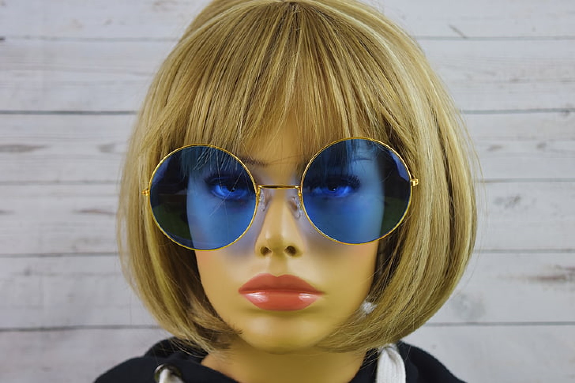 photograph of mannequin in sunglasses and wig