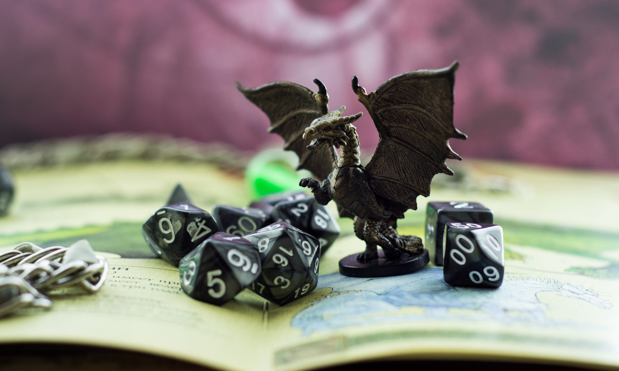 photograph of game dice and figurine