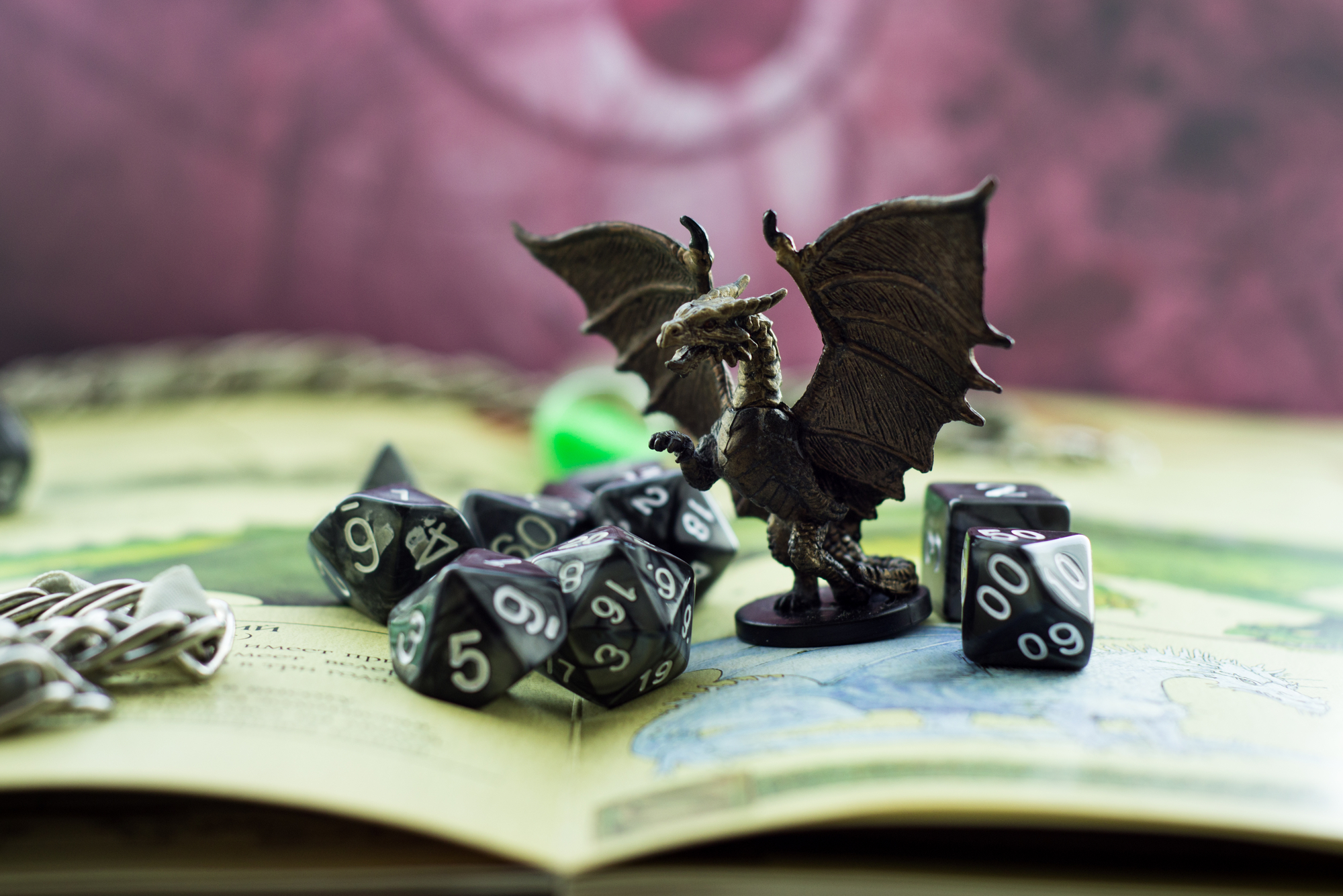 photograph of game dice and figurine