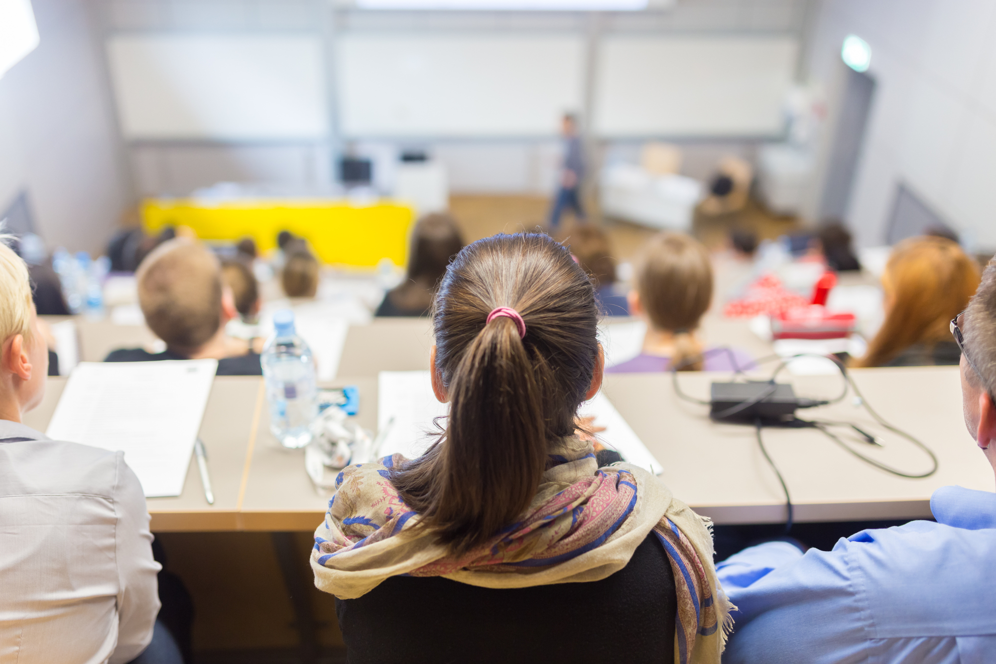 photograph of students attending class in lecture hall