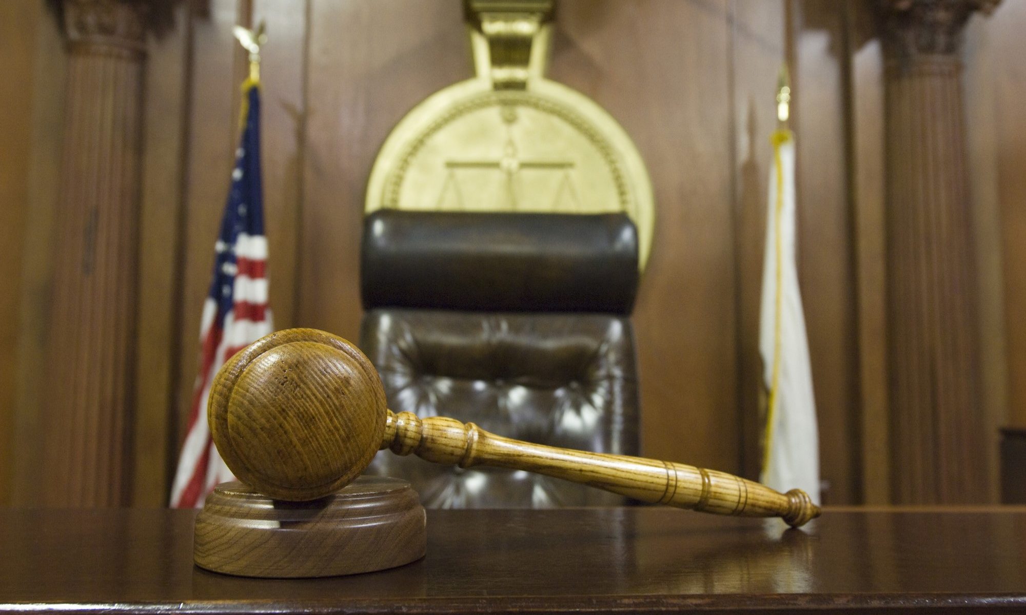 photograph of gavel and judge's seat in courtroom