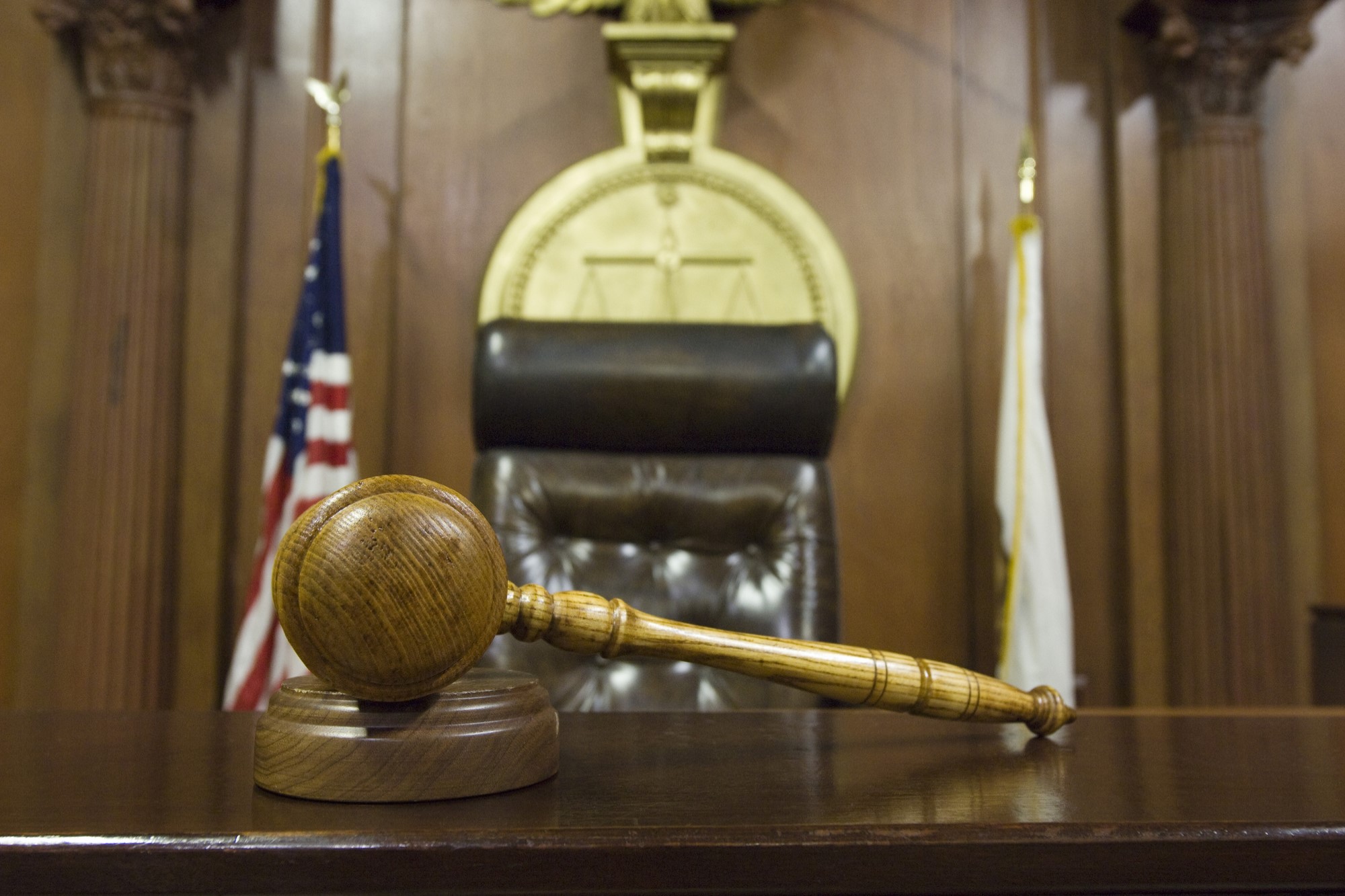photograph of gavel and judge's seat in courtroom