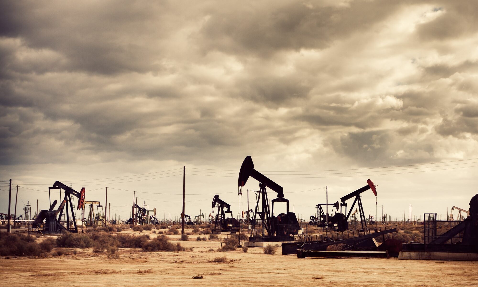 photograph of oil pumps in the desert
