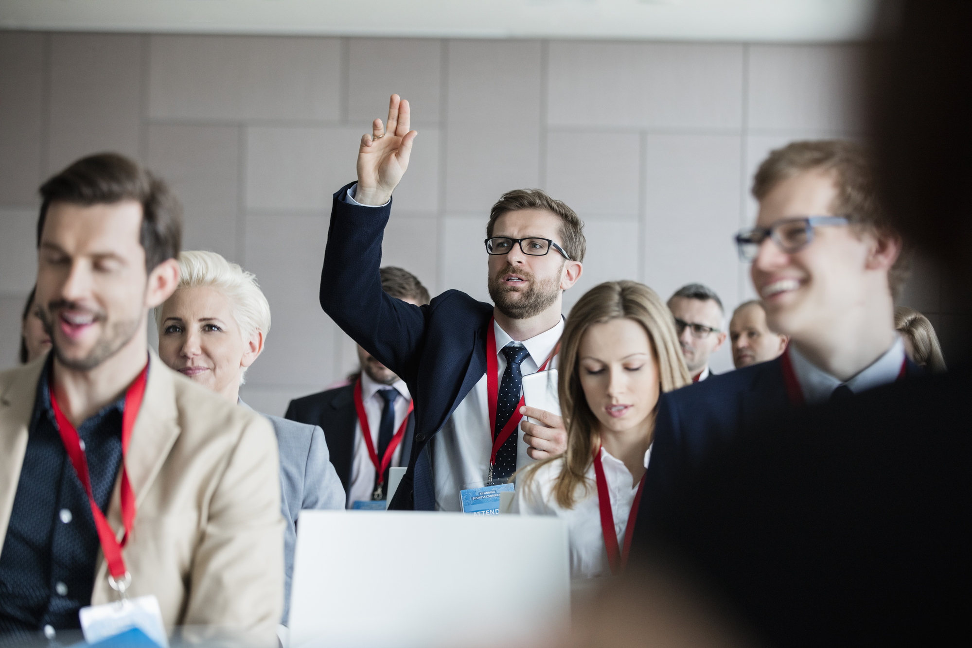 photograph of journalist raising hand