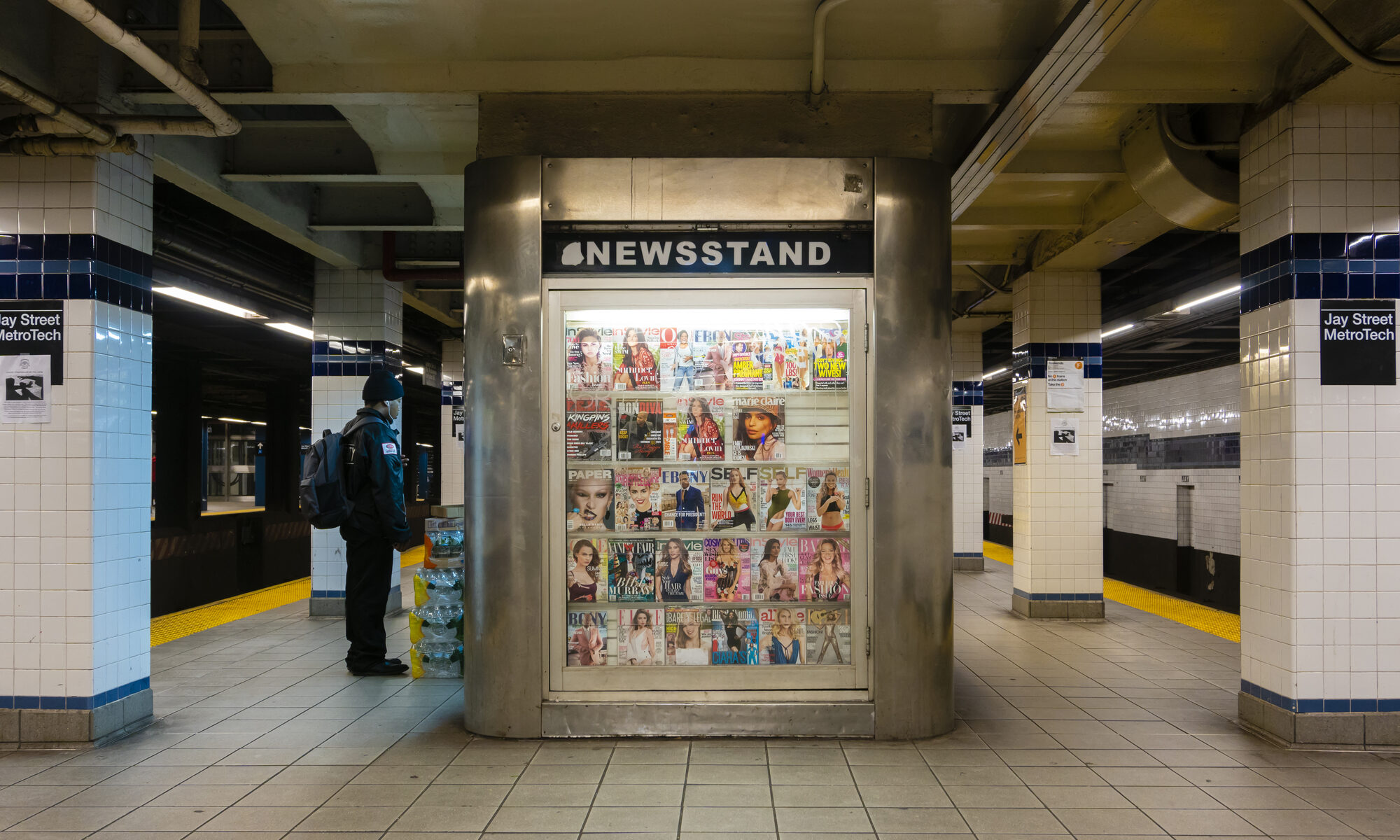 photograph of newsstand in subway filled with celebrity magazines