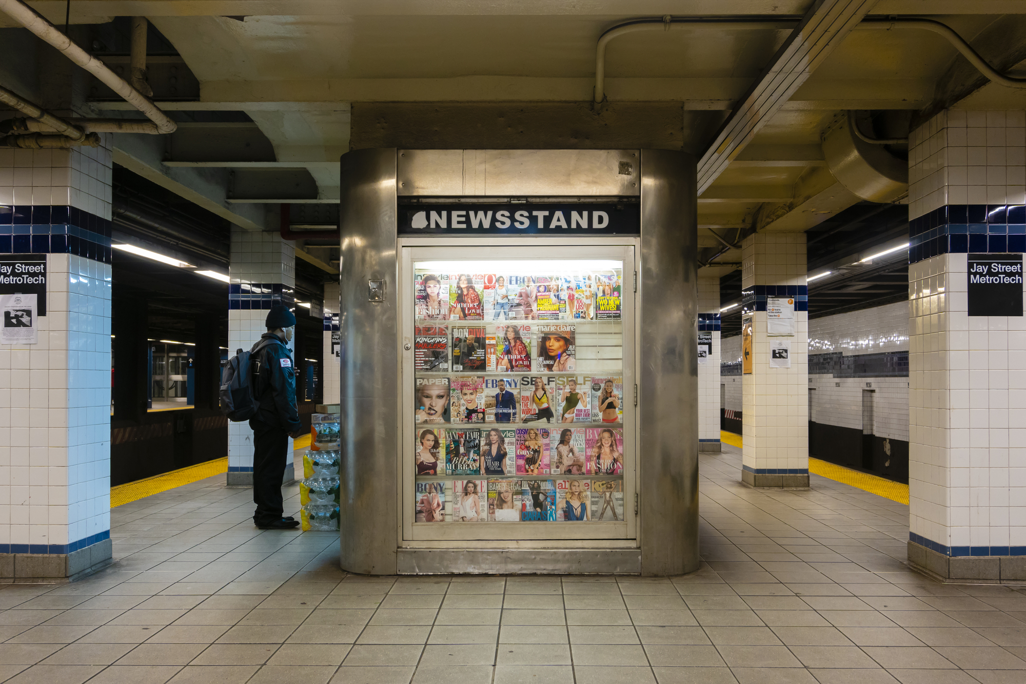 photograph of newsstand in subway filled with celebrity magazines