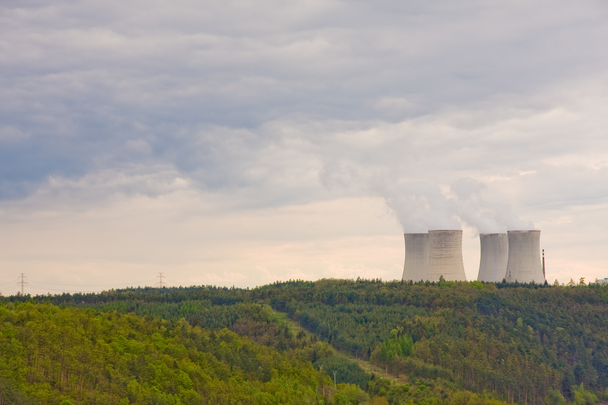 nuclear power plant tucked in rolling green hills