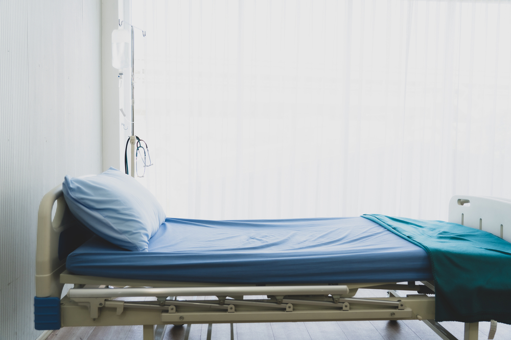 photograph of empty hospital bed