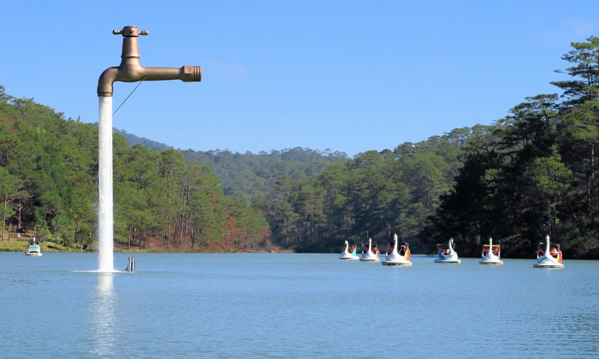 photograph of freestanding faucet on lake