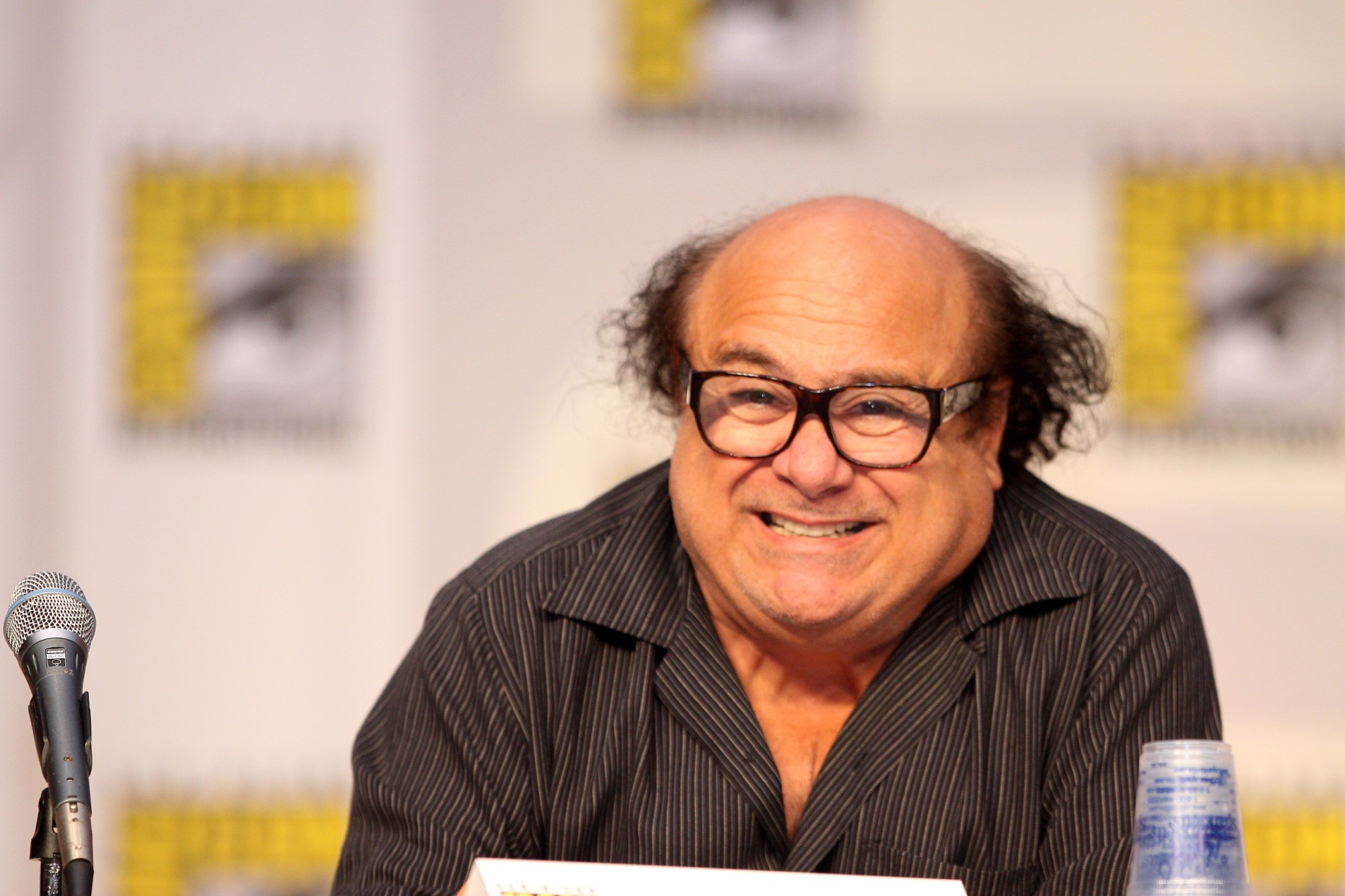 photograph of Danny DeVito at ComicCon panel for IASIP