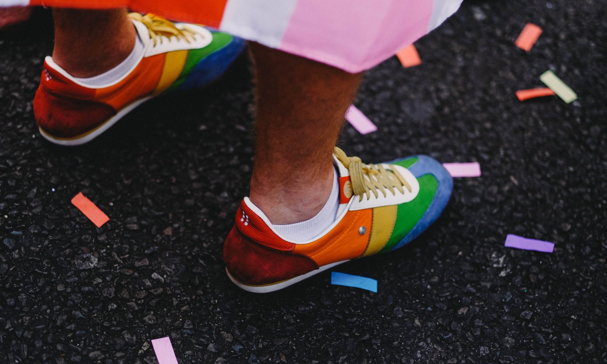 photograph of multicolored shoes at Pride parade