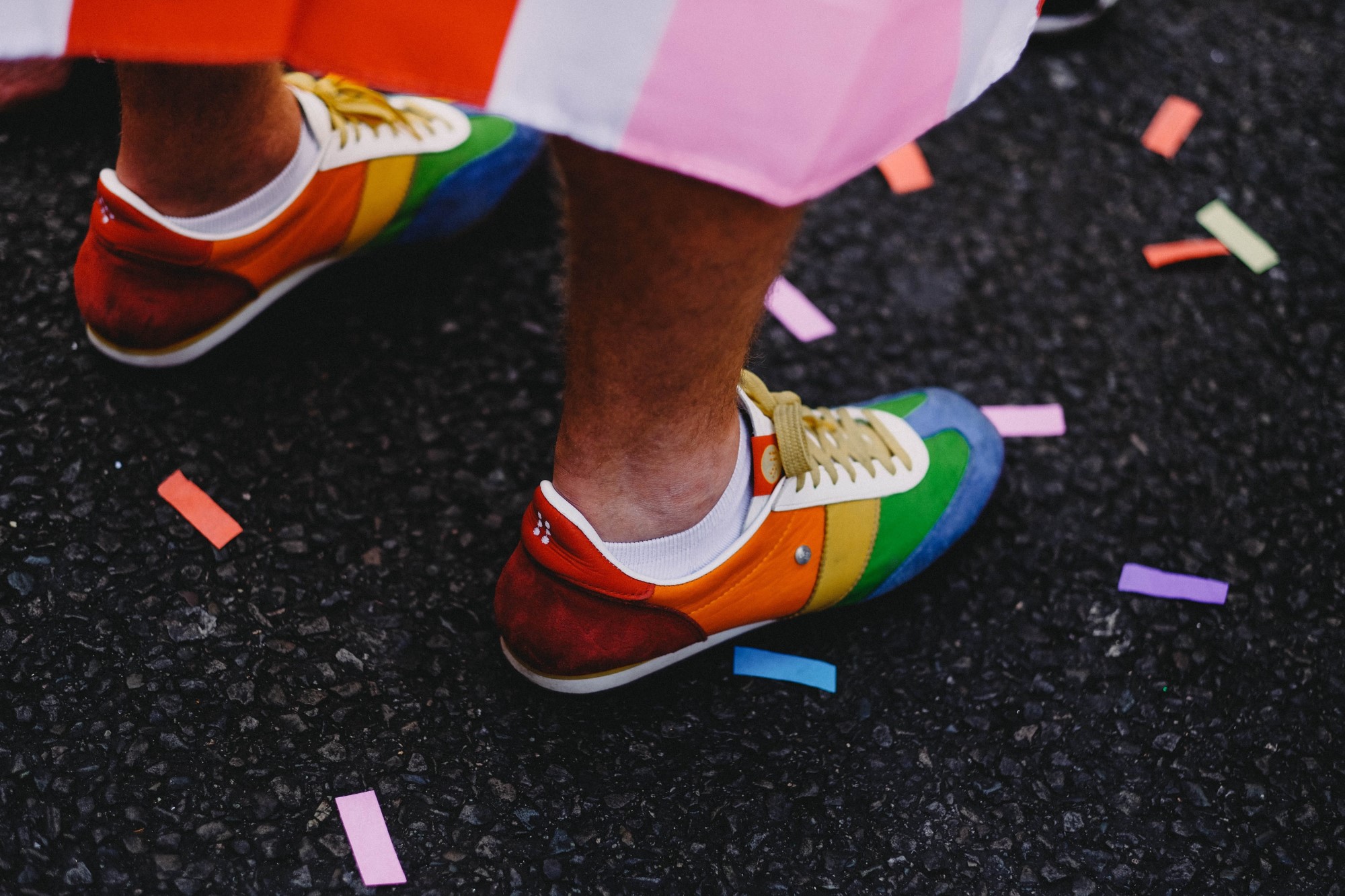 photograph of multicolored shoes at Pride parade