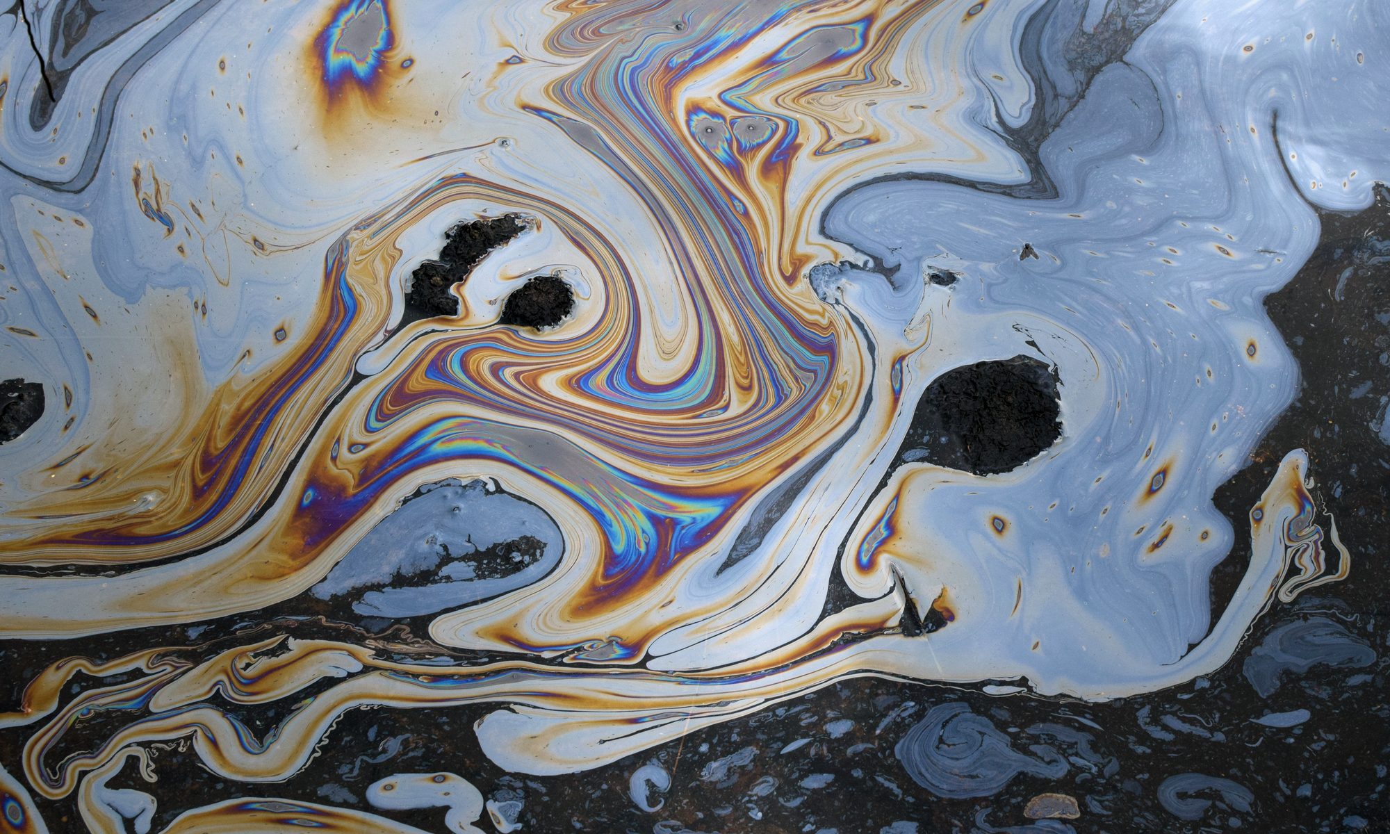 photograph of oil mixing with water